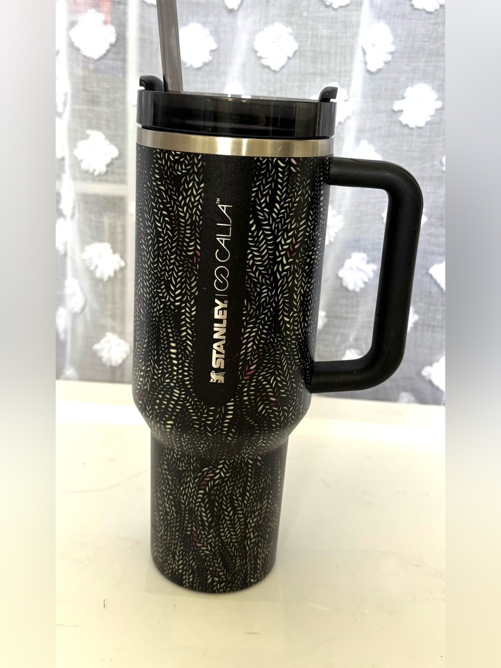 Stanley Black Travel Mug with Subtle Metallic Pattern and Handle